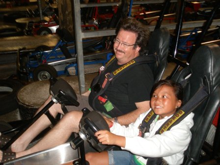 Kasen and Daddy riding go karts